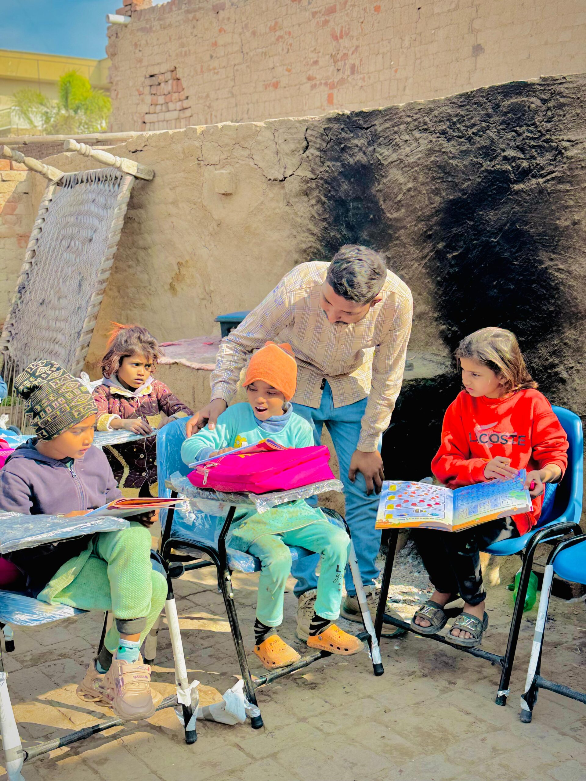Children studying with learning materials during Kingdom First Mission education support